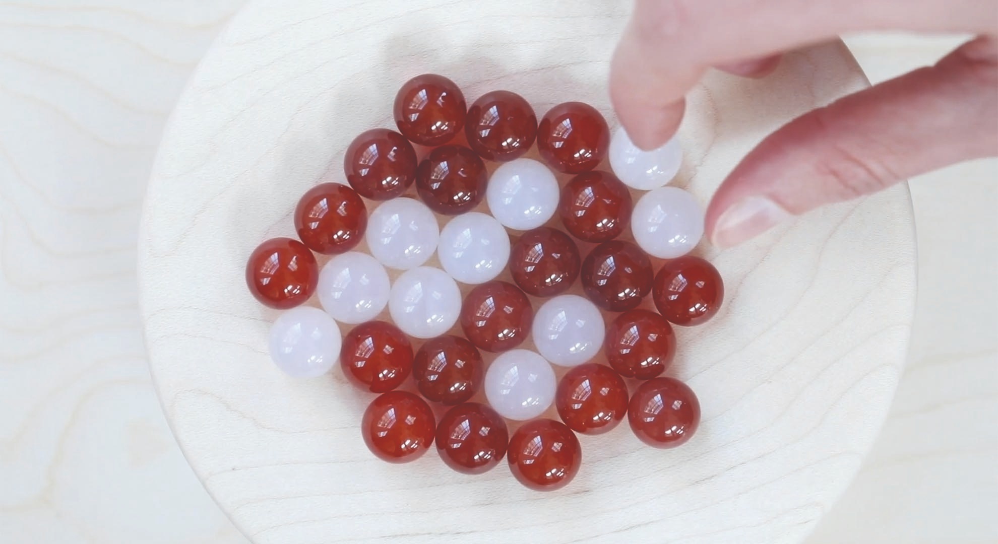 Massage balls to be inserted into therapeutic garments.