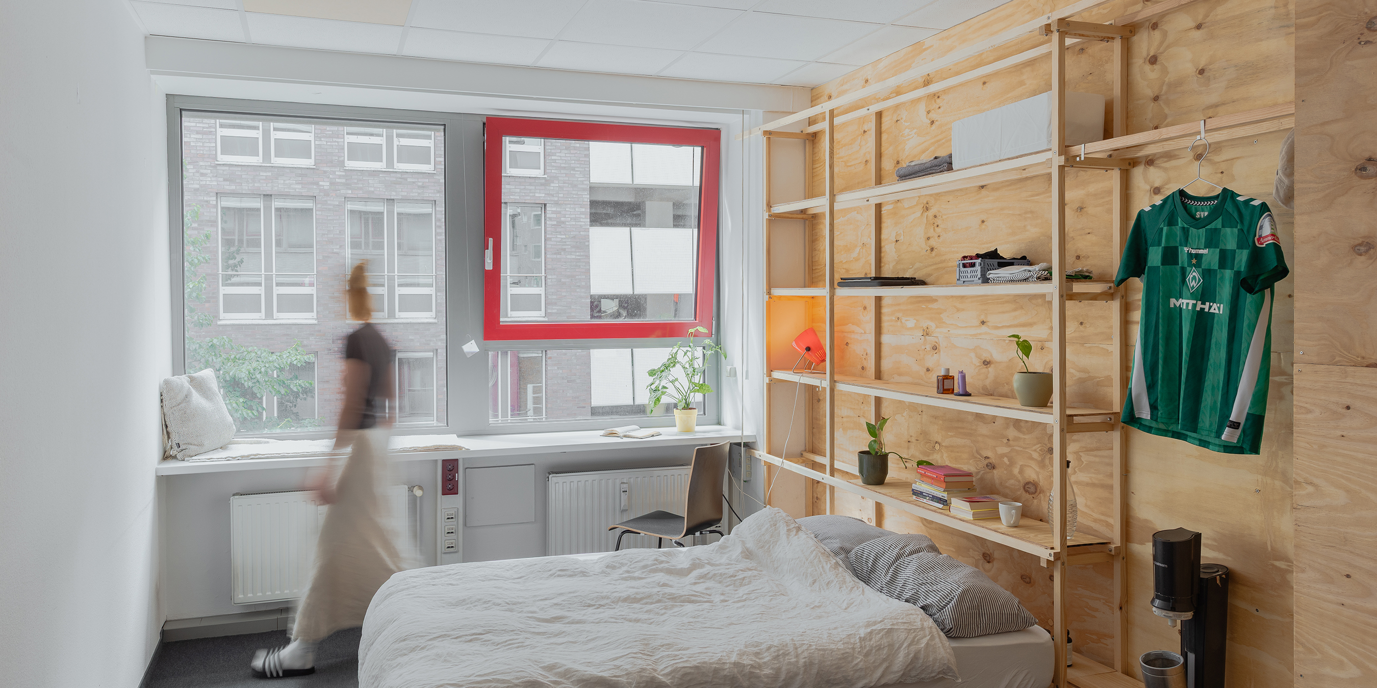 Bedroom in communal housing project shaped by social architecture.