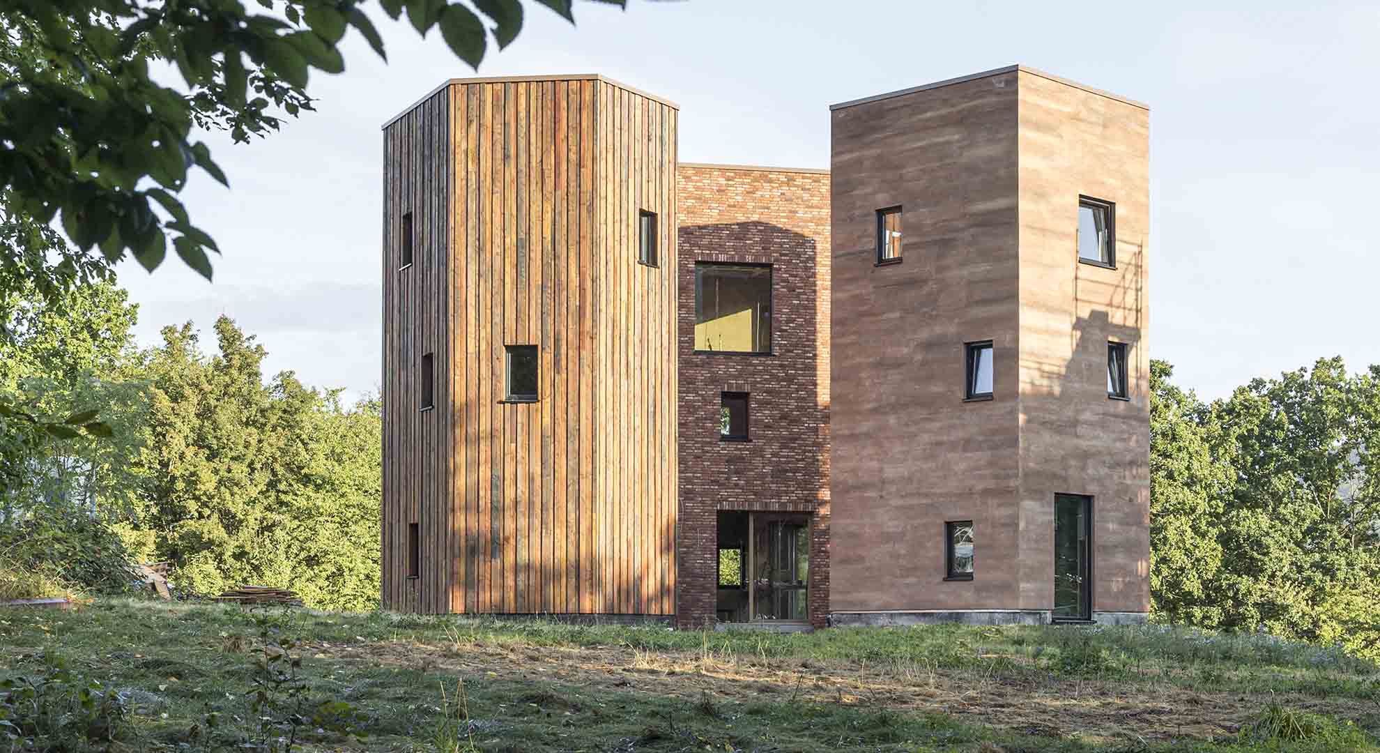 Sustainable building made of wood and brick, designed with a focus on conserving resources and reducing environmental impact.