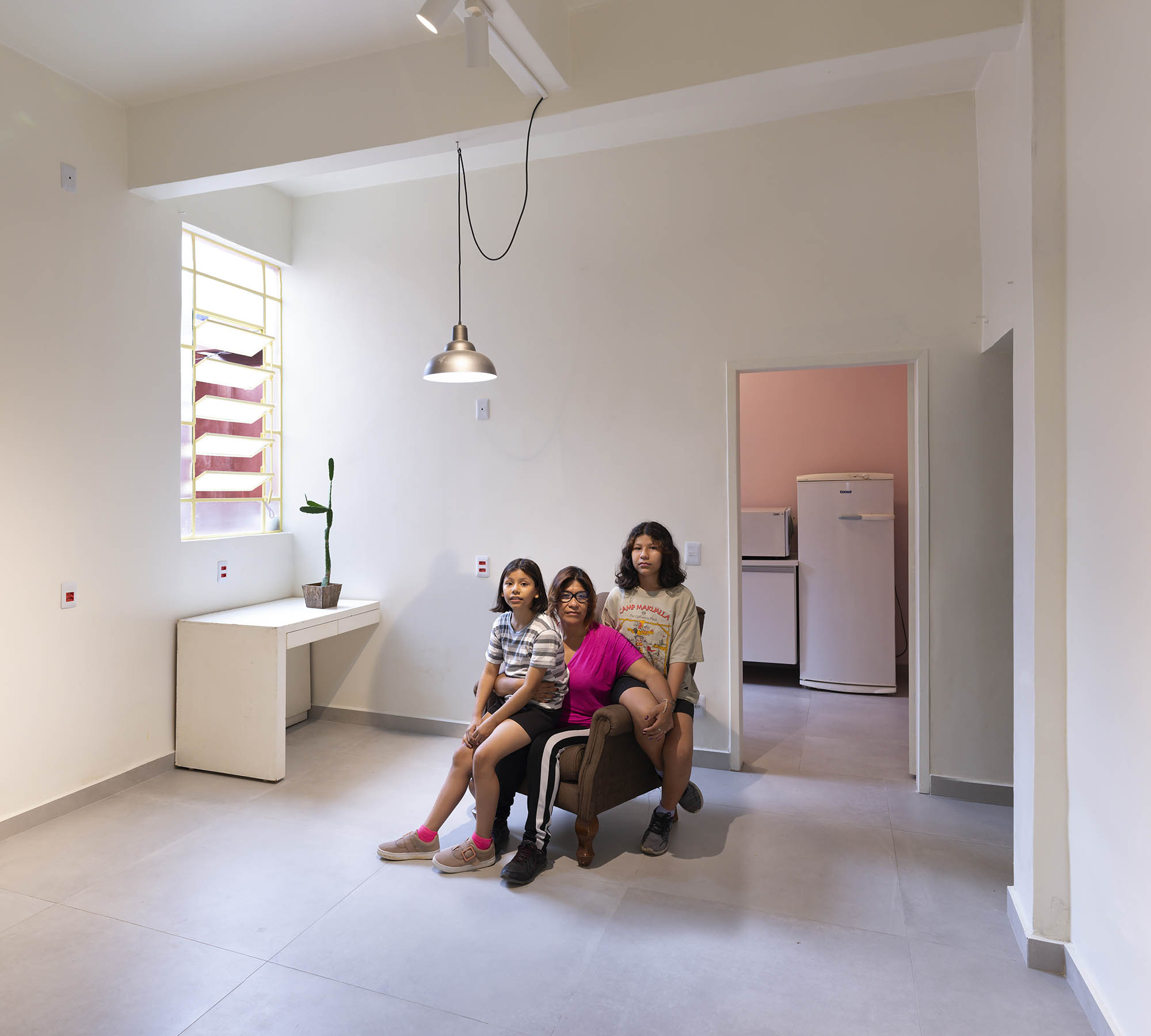 Family on the day they received keys to their new dignified housing