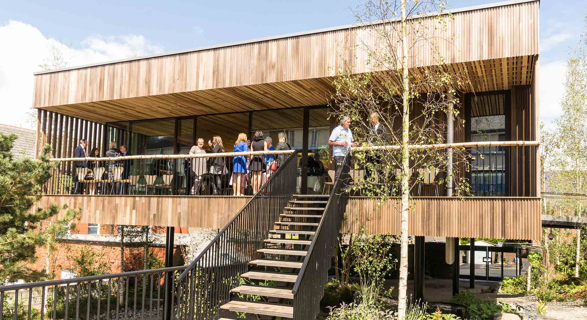 Maggie’s Oldham, designed by dRMM Architects with landscaping by Rupert Muldoon, has been dubbed a treehouse building by visitors as they feel like they are in a sheltering forest close to nature and elevated above the ground. Photo © Maggie’s Centre